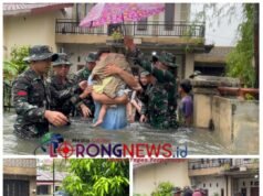 Prajurit Yonkav 6/NK Bantu Warga Terjebak Banjir di Asam Kumbang