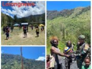 Satgas Yonif 700/Wyc Bantu Warga Mayuberi Bangun Lapangan Voli Demi Jalin Keakraban