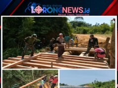 Satgas Pamtas RI-Malaysia Yonarmed 19/Bogani Bersama Warga Gotong Royong Bangun Jembatan Untuk Mempermudah Akses Masyarakat Perbatasan