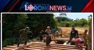 Satgas Pamtas RI-Malaysia Yonarmed 19/Bogani Bersama Warga Gotong Royong Bangun Jembatan Untuk Mempermudah Akses Masyarakat Perbatasan